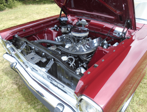 A classic car engine restored by Upper Classics NZ is showcased.